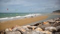 WISSANT, FRANCE Ã¢â¬â AUGUST 28, 2016: The beach with kite surfers. View with the Cap Blanc Nez in the background